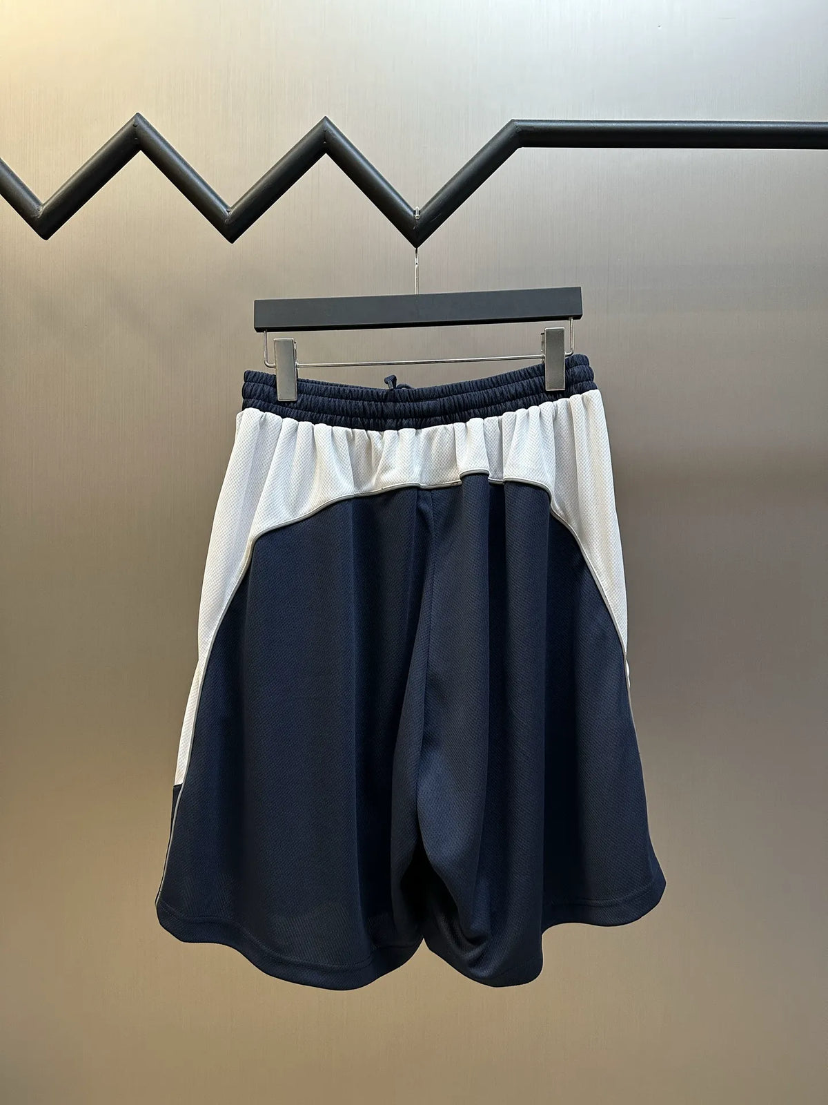 Navy shorts with contrast white waistband and elastic drawstring