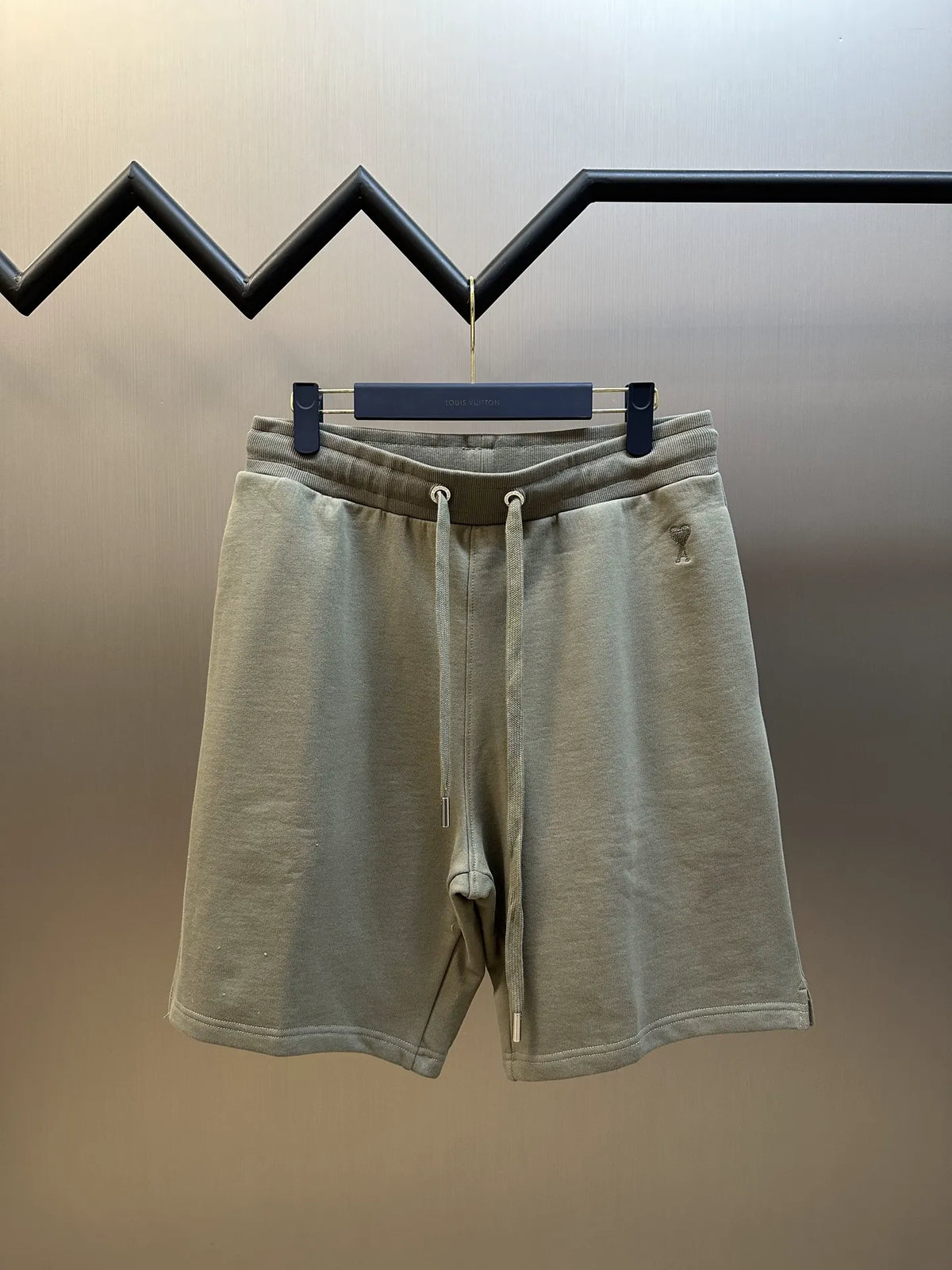 Light taupe drawstring shorts with elastic waistband and side pockets