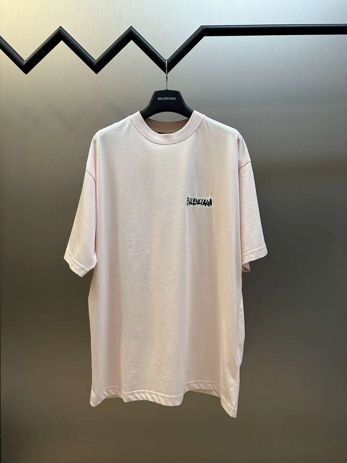 Balenciaga light pink short-sleeve T-shirt with small chest logo.