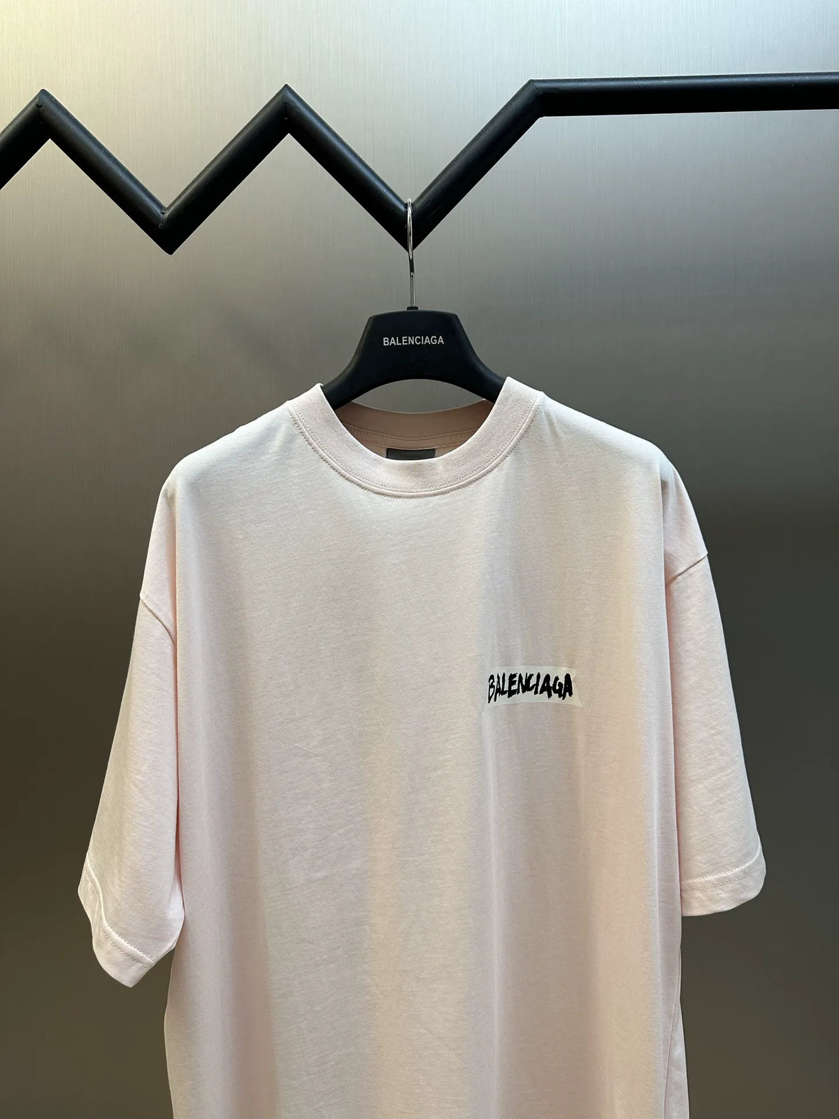 Balenciaga light pink short-sleeve T-shirt with small left chest logo.