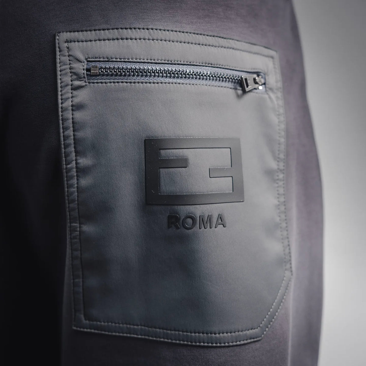 Fendi Roma jogger pants pocket detail with embroidered logo patch and zipper