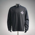 Black long-sleeve turtleneck top with multicolor diamond logo on left chest
