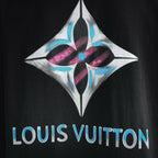 Close-up of multicolor diamond logo and “LOUIS VUITTON” print on black long-sleeve top