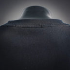 Back collar view of black long-sleeve turtleneck top with seam detail