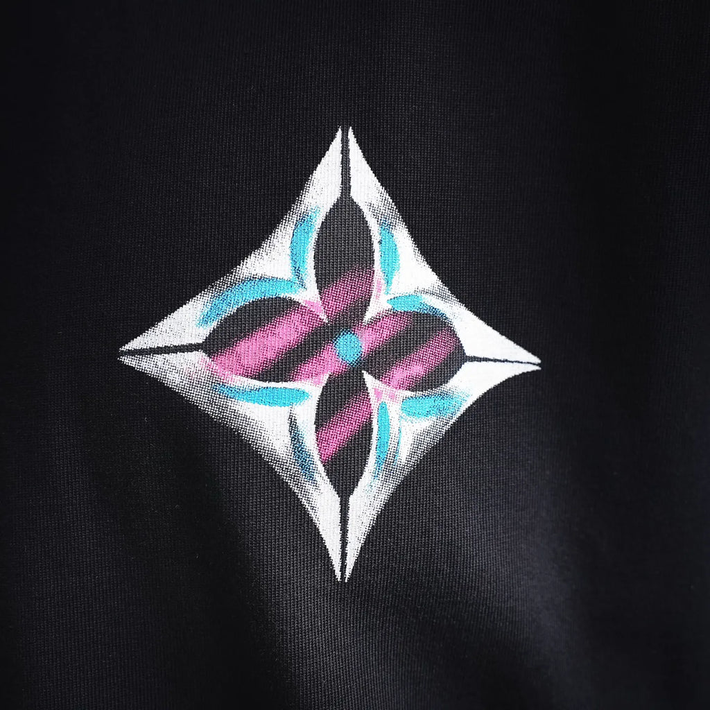 Diamond logo patch on the chest of a black long-sleeve turtleneck top