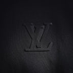 Louis Vuitton LV monogram emblem on black mock neck shirt front