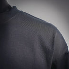 Louis Vuitton long-sleeve mock neck shirt, black fabric texture, side view