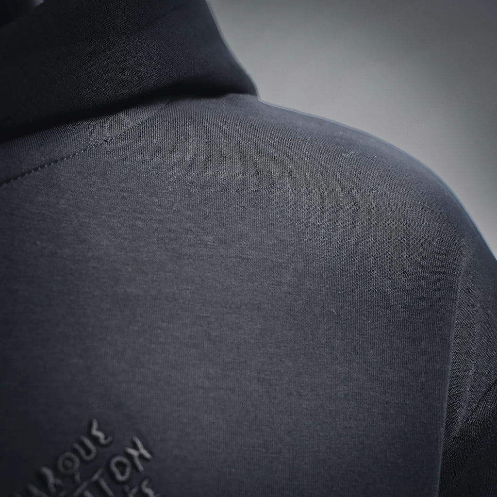 Black hoodie shoulder with small logo embroidery