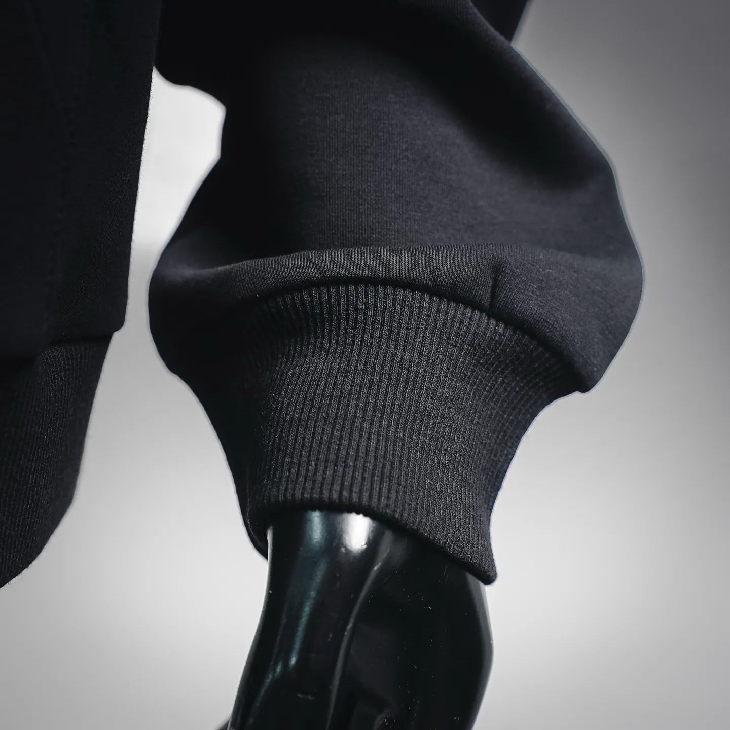 Black hoodie ribbed cuff and sleeve opening