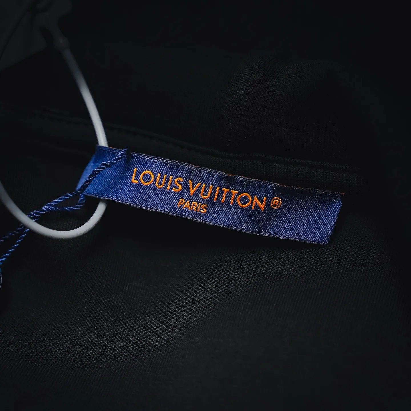 Louis Vuitton Paris fabric neck label inside black hoodie collar