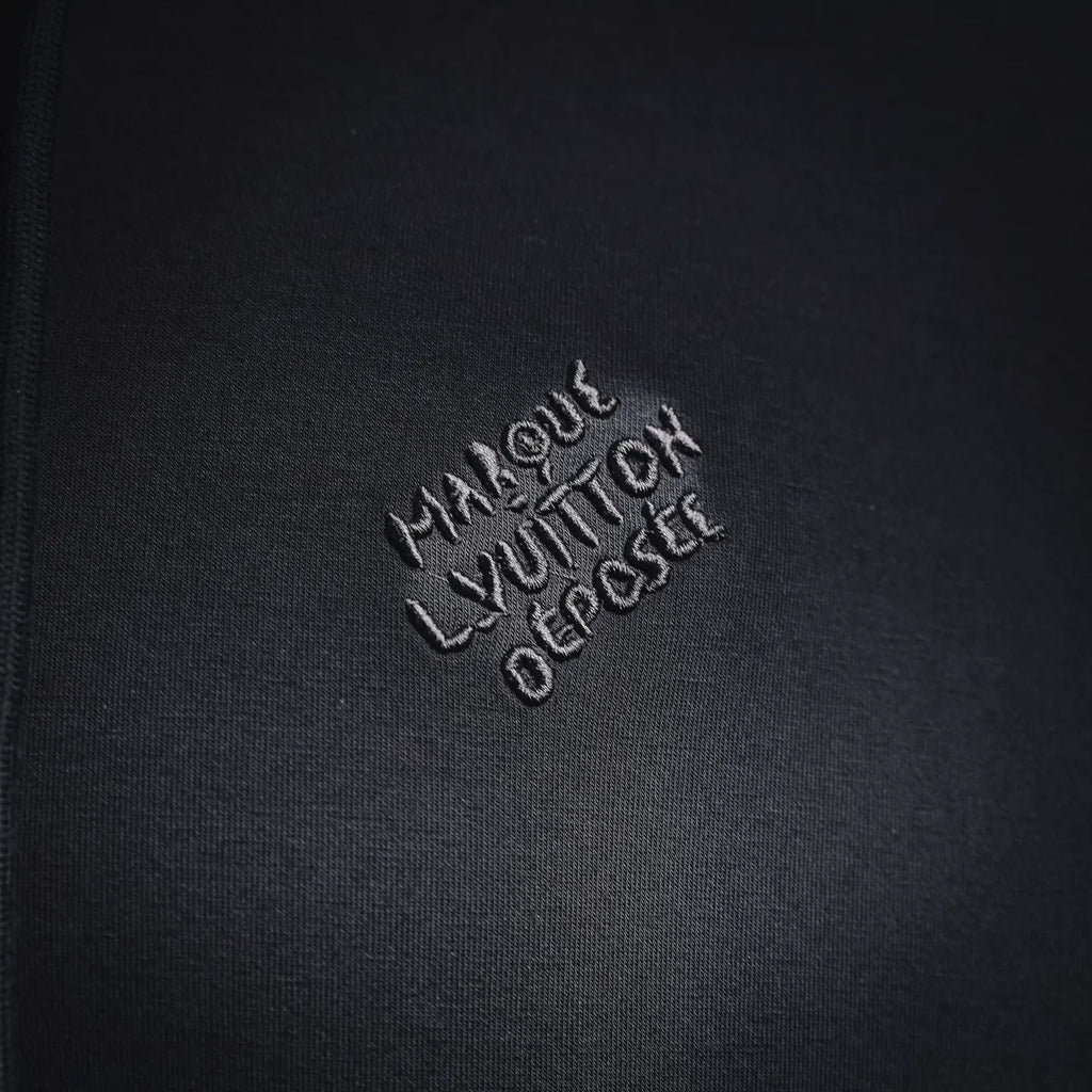 Black hoodie chest logo embroidery reading Louis Vuitton
