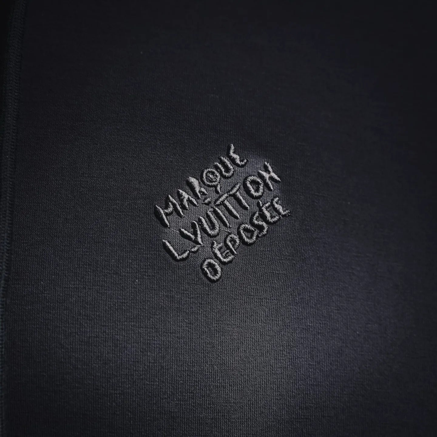 Black hoodie chest logo embroidery reading Louis Vuitton