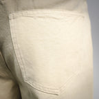 Light beige pants front pocket with stitched curved opening
