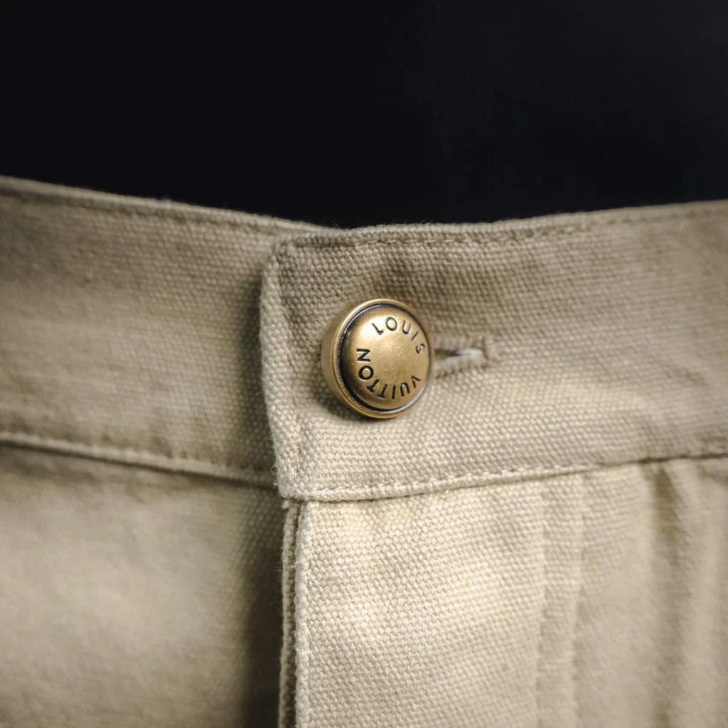 Light beige pants button with LOUIS VUITTON logo