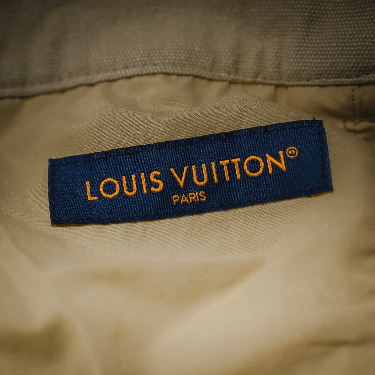 Light beige pants with LOUIS VUITTON PARIS fabric label