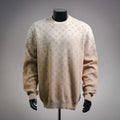 Long-sleeve sweater in light beige with repeating LV monogram pattern.