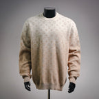 Long-sleeve sweater in light beige with repeating LV monogram pattern.