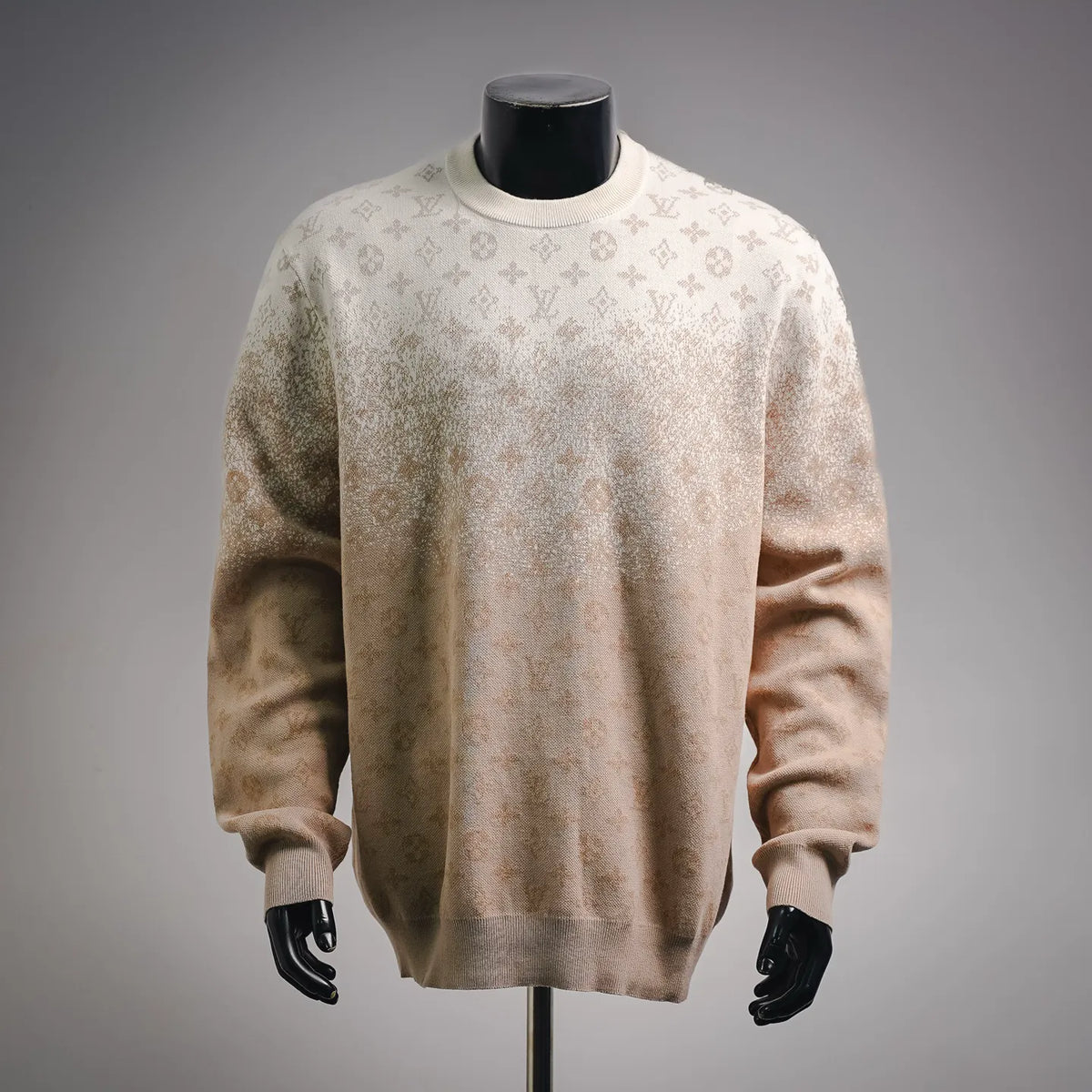 Long-sleeve sweater in light beige with repeating LV monogram pattern.