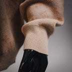 Long-sleeve sweater cuff with ribbed knit and LV monogram pattern.