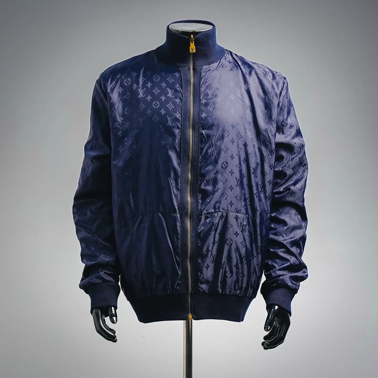 Navy LV zip-up coat with allover monogram pattern and ribbed cuffs
