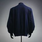 Navy LV zip-up coat, back view with ribbed hem and full sleeves