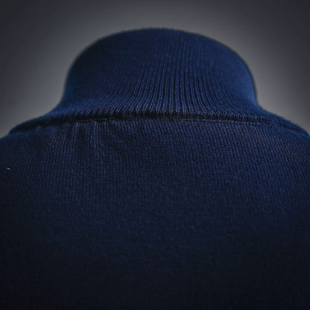 Navy ribbed knit collar of LV zip-up coat with smooth fabric texture