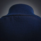 Navy ribbed knit collar of LV zip-up coat with smooth fabric texture