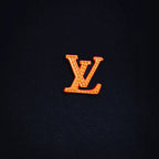 Embroidered LV logo on navy knit fabric of a zip-up coat