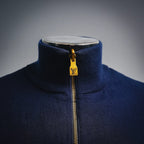 Navy LV zip-up coat neckline with ribbed collar and gold zipper pull