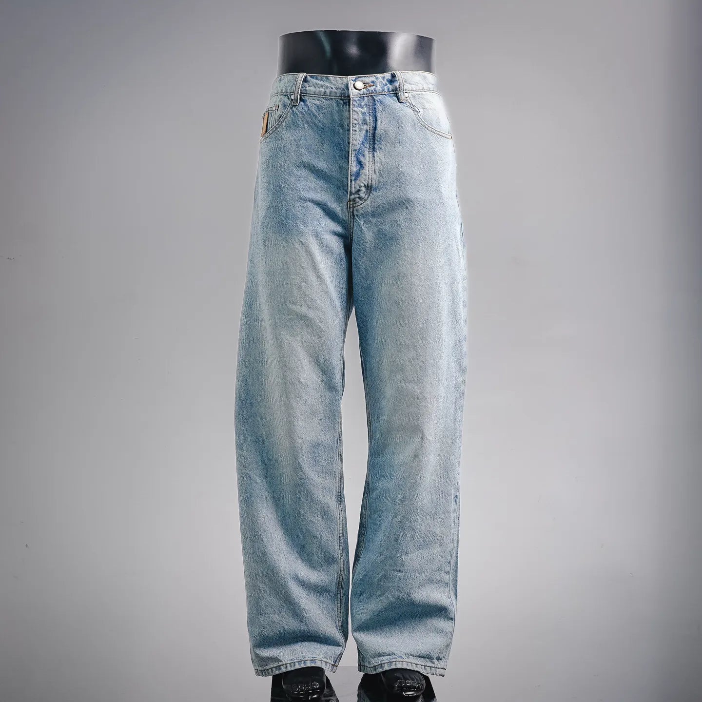 Light blue denim jeans with straight legs and button-fly closure