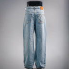 Light blue denim pants, back view with two patch pockets and button closure