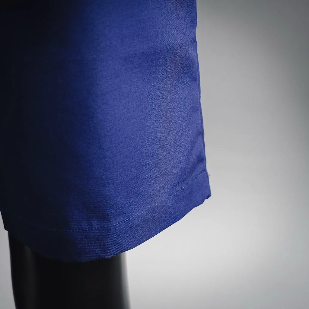 Blue shorts-style pants hem with fabric drape detail