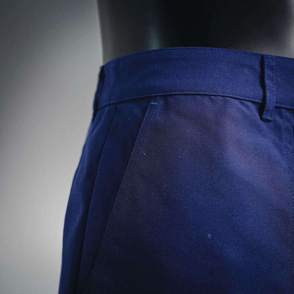 Blue shorts-style pants waistband and side seam detail