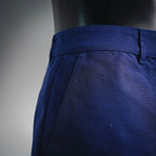 Blue shorts-style pants waistband and side seam detail