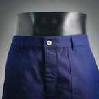 Blue shorts-style pants front with button waistband and belt loops