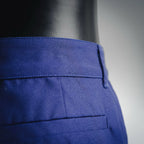 Blue shorts-style pants back panel with crease and stitched seams