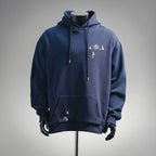 Navy hoodie with drawstring hood, kangaroo pocket, and small bird embroidery on chest