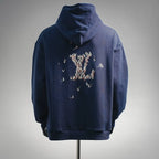 Navy hoodie with embroidered bird graphic on back and drawstring hood