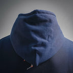 Navy hoodie hood with small embroidered detail near lower back