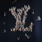 Navy hoodie back with dense embroidered bird graphic