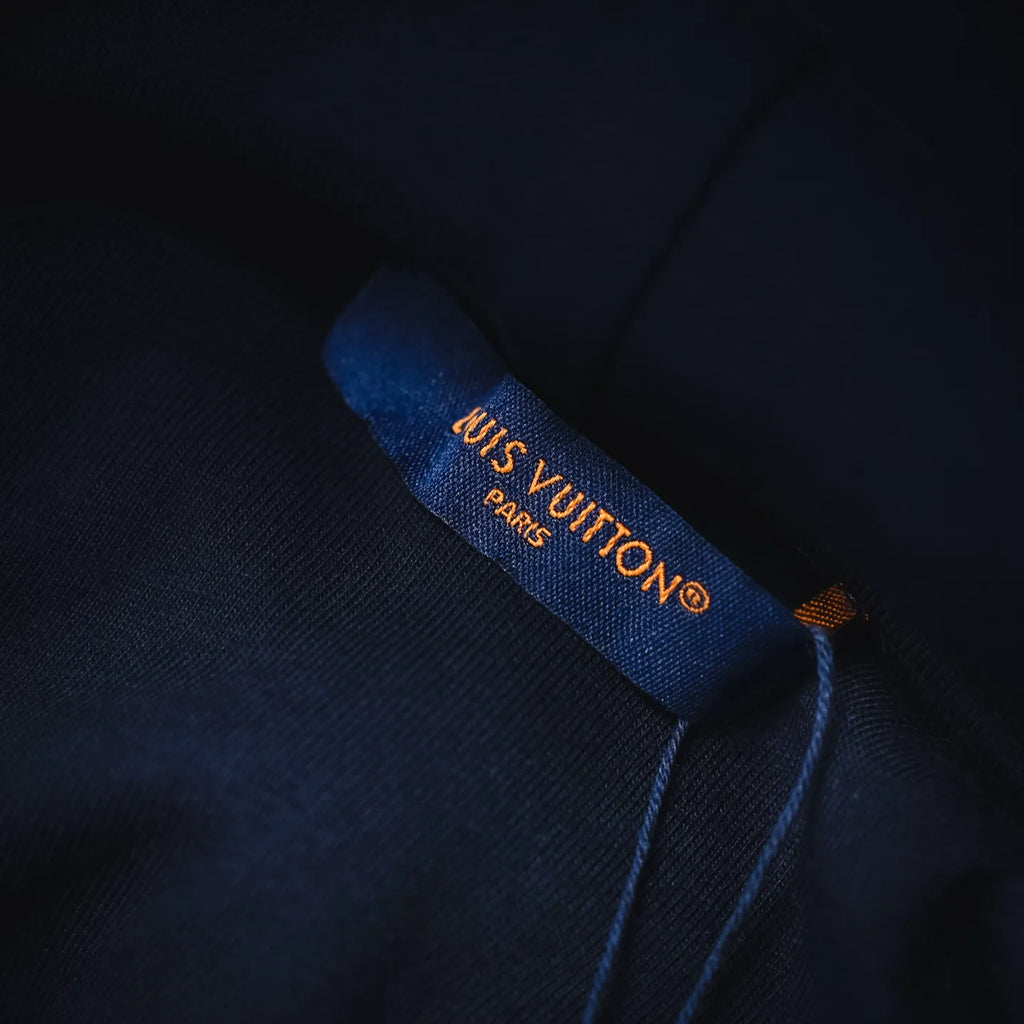 Navy hoodie inner neck label with LV logo and Paris text