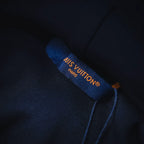 Navy hoodie inner neck label with LV logo and Paris text