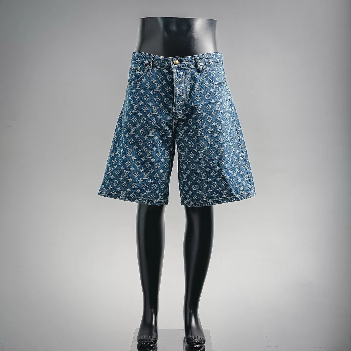 Blue denim shorts with LV-style monogram pattern, button fly and belt loops