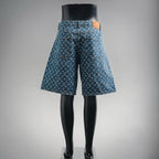 Blue denim shorts with LV-style monogram pattern, rear view and straight hem