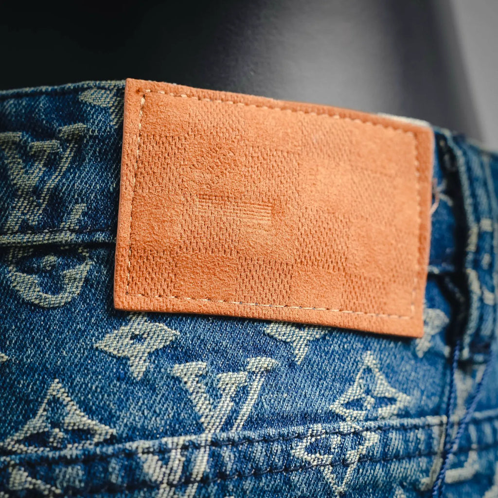 Denim shorts with tan leather waist label detail