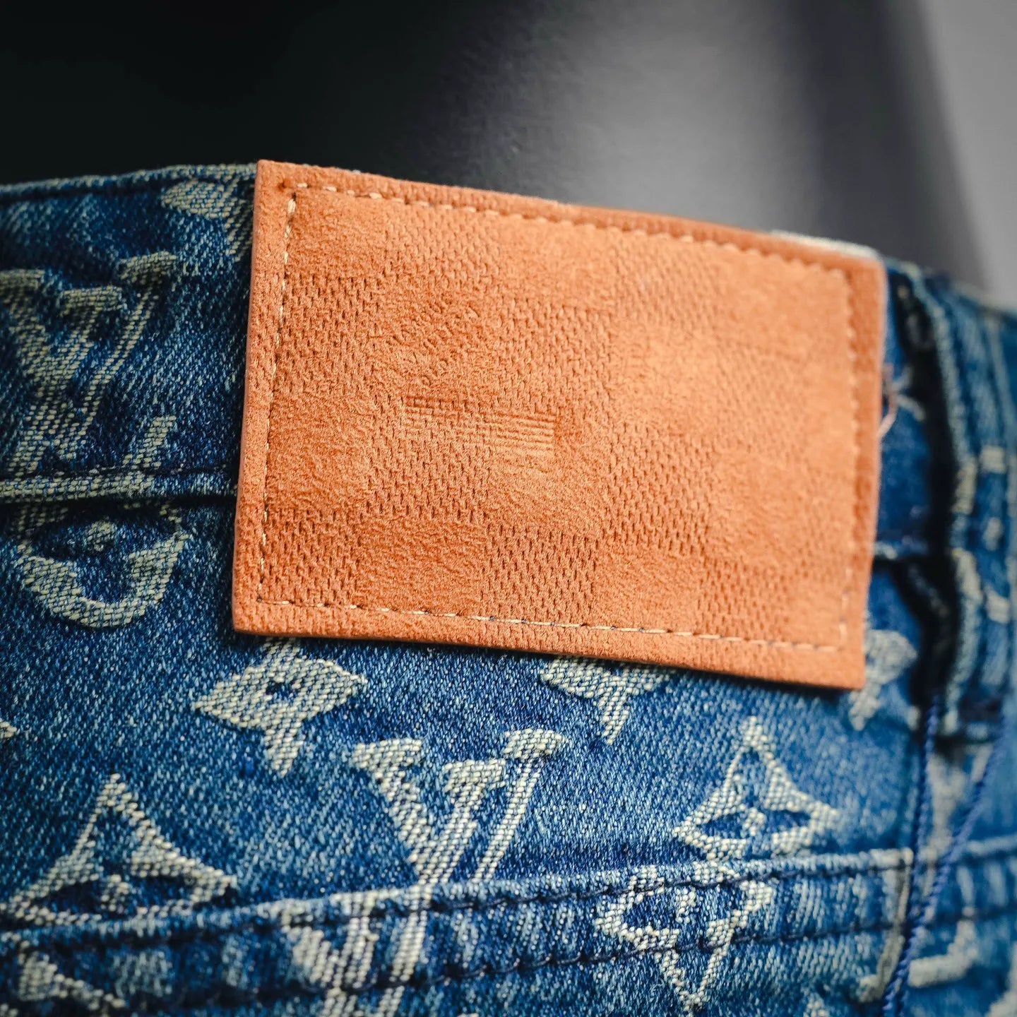 Denim shorts with tan leather waist label detail