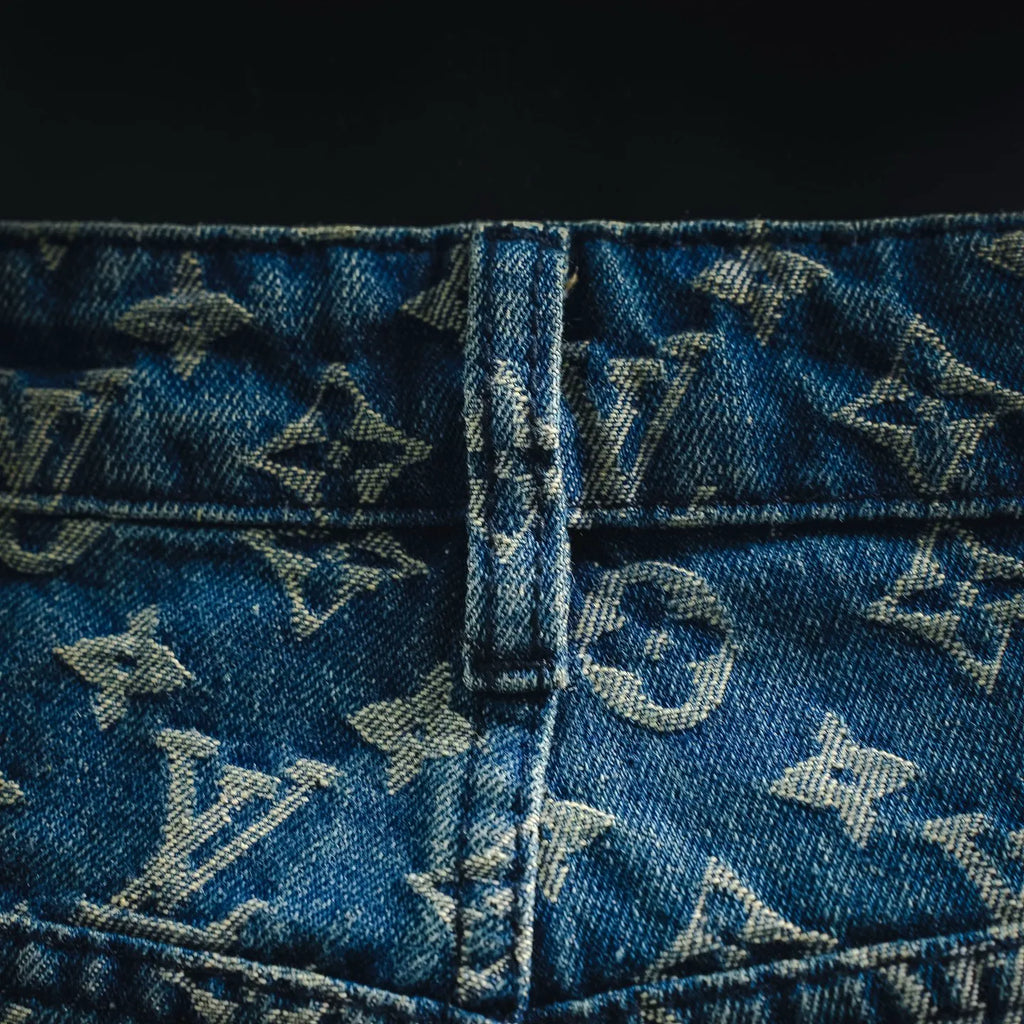 Blue denim shorts waistband with center seam and LV monogram pattern