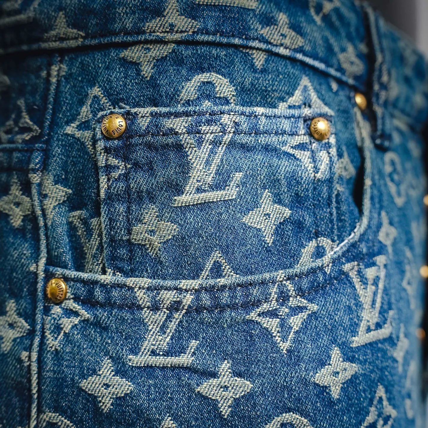 Blue denim shorts with gold buttons and LV monogram front pocket
