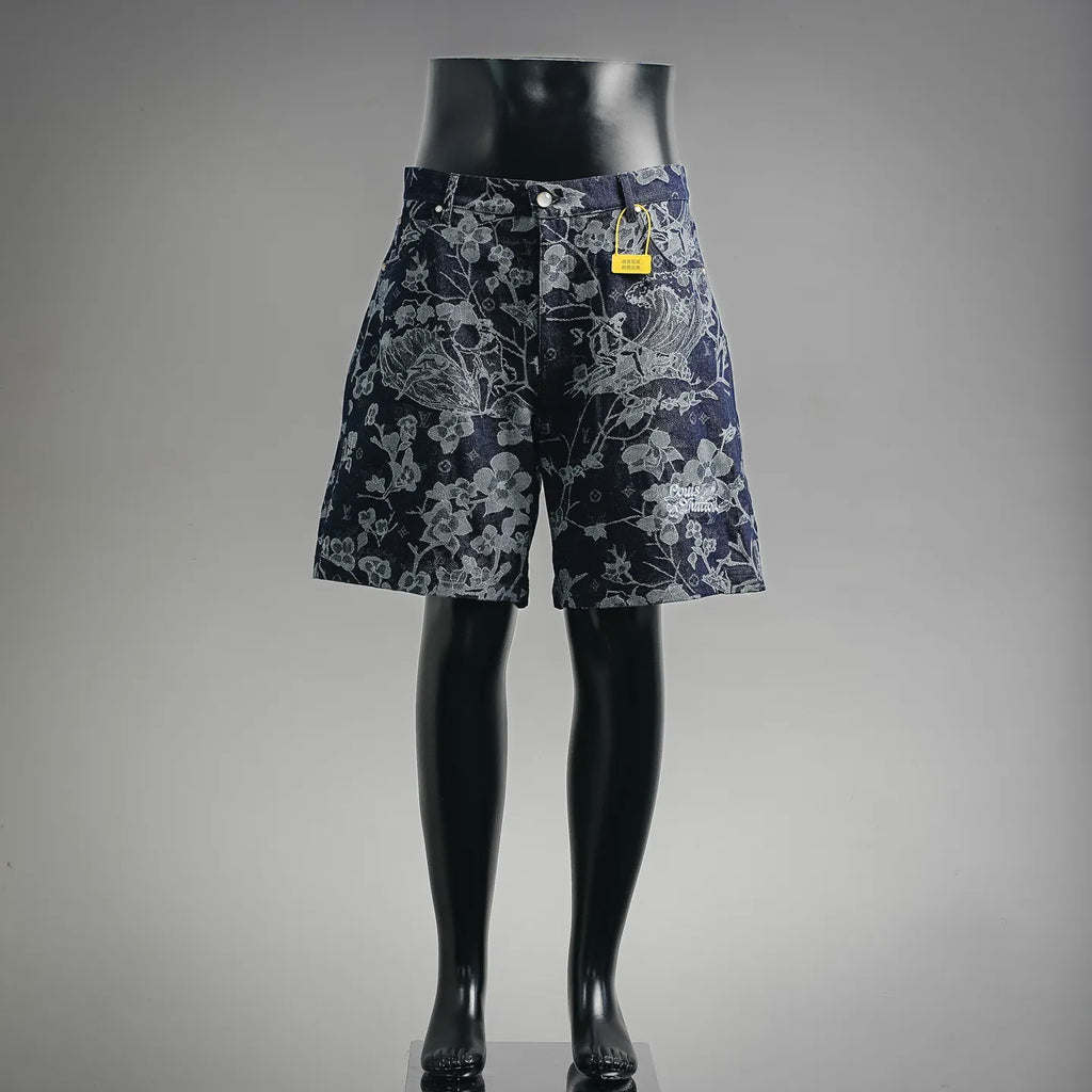 Louis Vuitton pants in dark denim with light floral pattern, front view