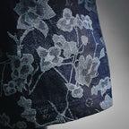 Dark denim fabric with light blue-gray floral pattern
